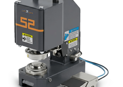 ClipsShop CS-TIDY-52 pneumatic grommet machine with a built-in carrying handle and an attached metal foot pedal on white background.